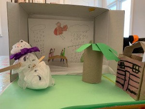 'Our Winter Garden' by Madeleine Browne.. Madeleine has created a 3d artwork of our Mount Merrion garden at Christmas time with snowman, tree, shed and images of our resident robin redbreast. Also in the picture is Madeleine with her sister Eleanor. Madeleine used all recycled materials to make her artwork including An Post parcel box, tissue paper, cardboard roll, lollipop sticks and cardboard box.